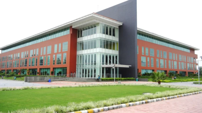 a building with a lawn and grass