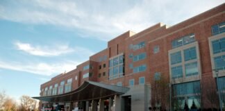 Top Multispeciality Hospitals in Chandigarh: Facilities & Care Best Multispeciality Hospitals in Chandigarh – Modern hospital building with doctors and nurses providing healthcare services