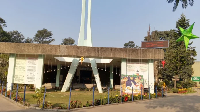 Christ the King Cathedral in Sector 19, Chandigarh, with a green Christmas star and string lights on its facade