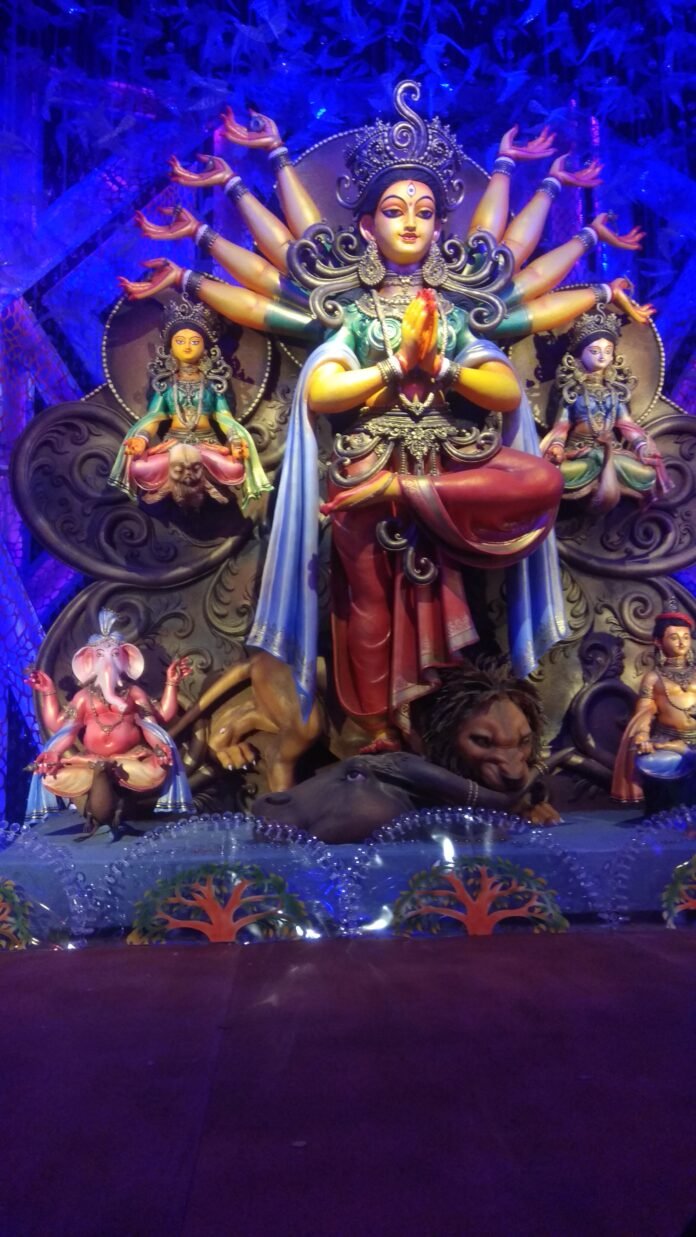 Ornate Durga idol with Ganesha, Lakshmi, Saraswati and Kartikeya during Durga Puja, as celebrated at Kalibari Chandigarh