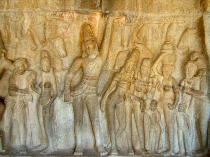 Ancient stone bas relief of Krishna lifting Govardhan Hill, the legend commemorated on Govardhan Puja in Chandigarh