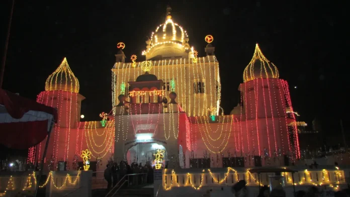 Gurdwara Katalgarh Sahib at Chamkaur Sahib at night, its domes covered in strings of golden and red lights