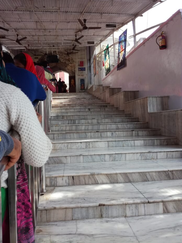 Devotees queue on the marble steps of Mata Mansa Devi Temple, Panchkula, during a Navratri mela