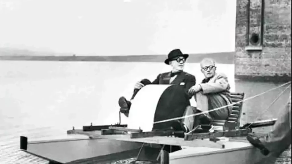 Two gentlemen riding the boat in a lake in an archival picture - history of chandigarh