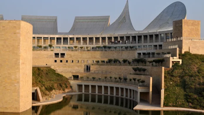 Virasat-e-Khalsa, Anandpur Sahib Virasat-e-Khalsa museum at Anandpur Sahib, sandstone galleries with curved steel roofs above a reflecting pool