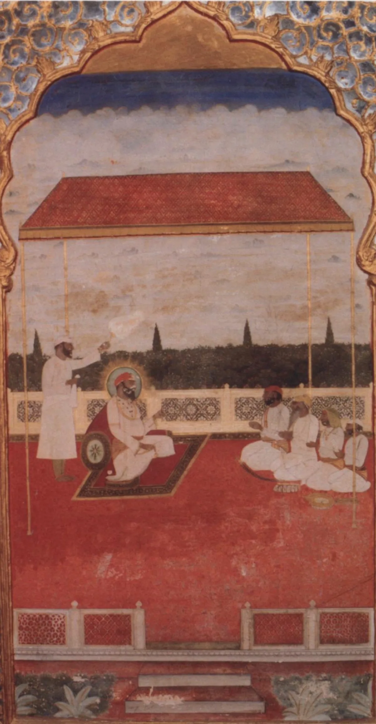 Painted mural of a seated ruler under a red-roofed canopy on a terrace, with an attendant standing behind him and courtiers seated to the right
