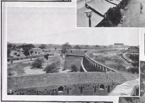 Old black and white photograph of a long brick rampart with small openings curving beside a dry moat at Bahadurgarh Fort